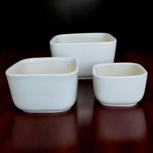 a group of white square bowls